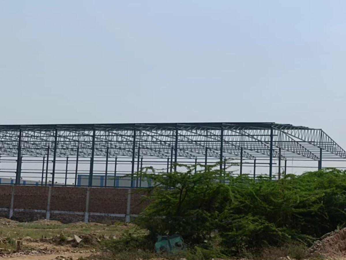 PEB steel frame structure under construction — R.R Teen Set Solution
