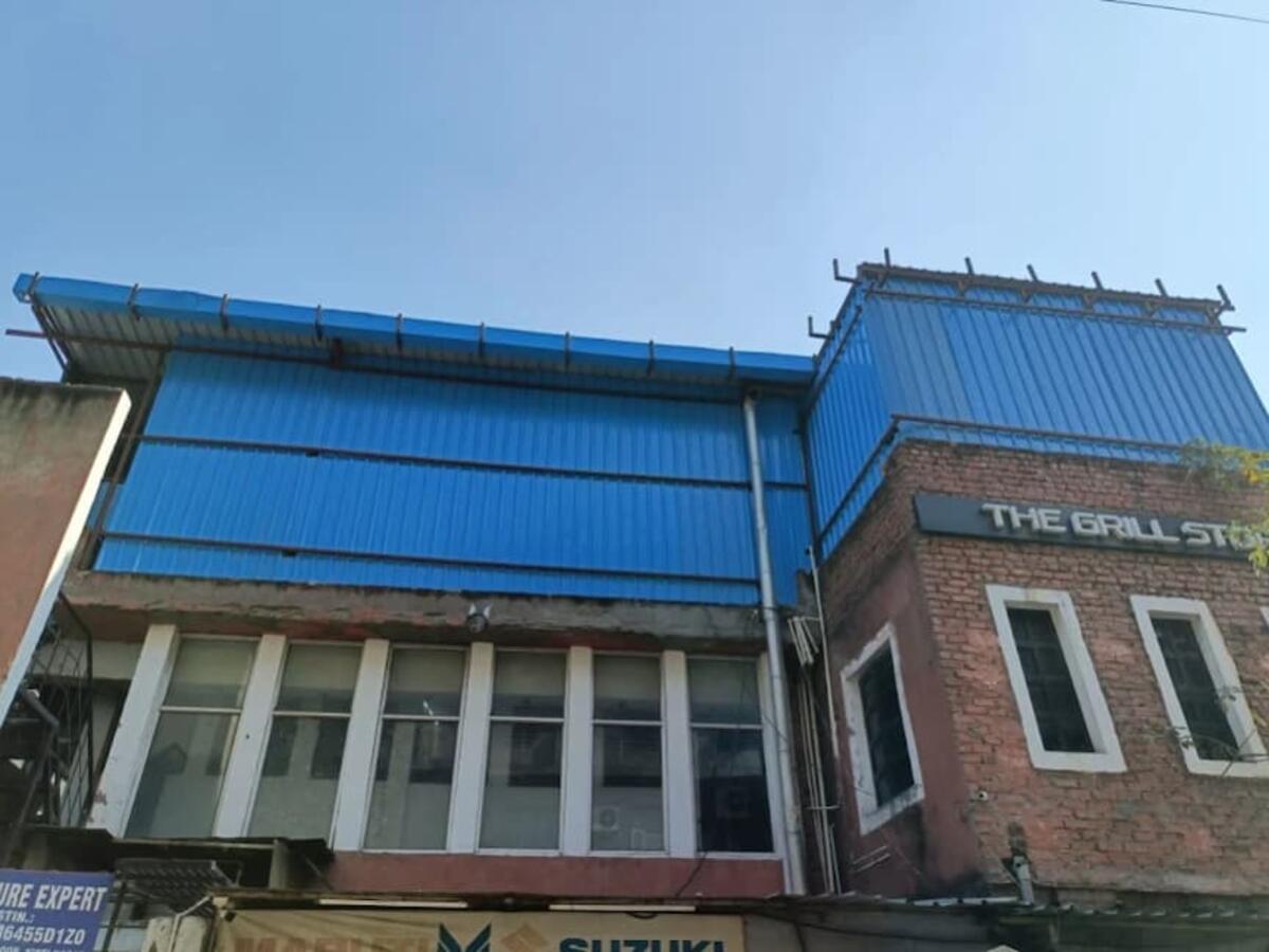 Commercial rooftop blue tin shed installation — R.R Teen Set Solution