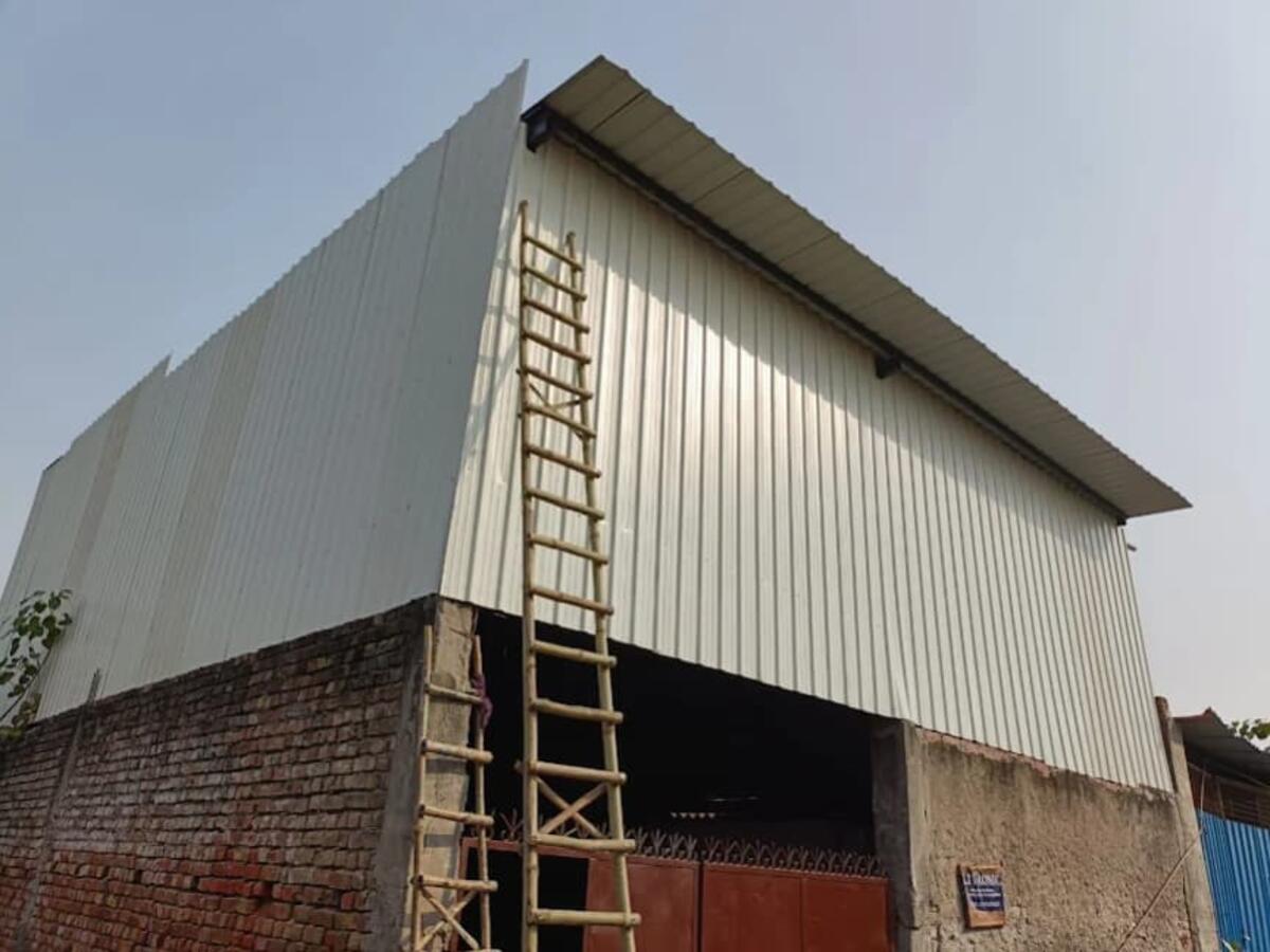 White warehouse tin shed with double door — R.R Teen Set Solution