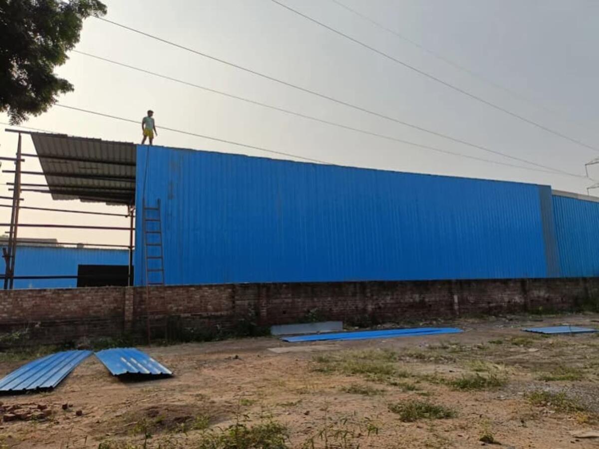 Industrial blue shed installation work in progress — R.R Teen Set Solution
